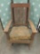 Vintage rocking chair with floral upholstery.