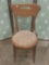 Vintage dining chair with paisley upholstered seat.