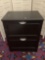 Modern wood black 2 drawer file cabinet with file dividers, approx 23x16x30 inches.