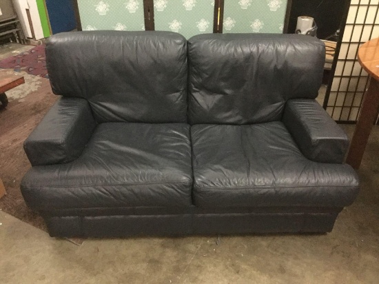 Chateau DAx Navy blue leather loveseat. Made in Italy. Measures approx 60x36x32 inches.