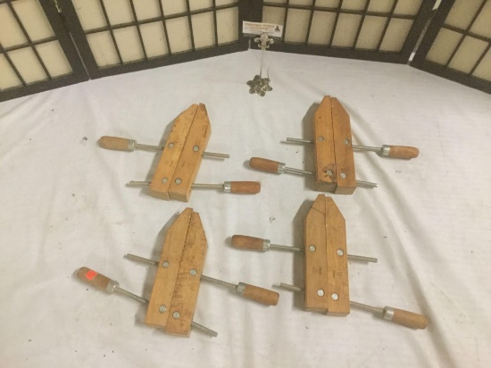 Four wooden 10 inch clamps, approx. 11x16x2 inches.