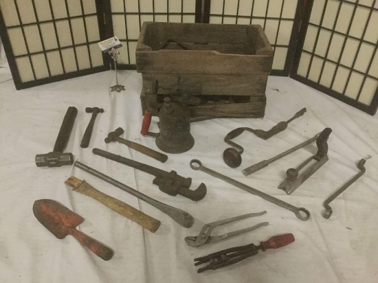Old crate full of vintage tools, blowtorch, wrench?s, hammers, hand drills, crowbars, & more.