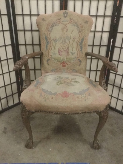 Vintage Rock-Ola wooden armchair w/carved bird neck arms and colorful upholstery.
