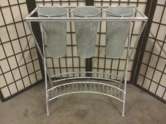Metal three pot planter stand, approx. 26x11x31 inches.