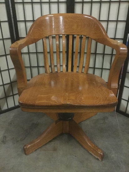 Wooden swiveling office chair without casters, approx. 24x24x33 inches.