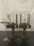 Pair of wooden candle holders w/glass top & birch tone candles, approx. 5x5x14 inches each.