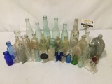 Large collection of vintage glass bottles.