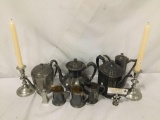 Collection of silver plate and pewter tea pots, cups and more.