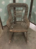 1800s antique child?s wicker rocking chair.