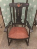 Early 1900s oak rocking chair with original decals.