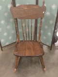 Antique Late 1800s oak pressback rocking chair.