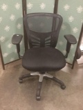 Mesh back swivel adjustable office chair.