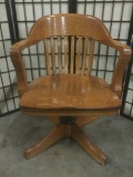 Wooden swiveling office chair without casters, approx. 24x24x33 inches.