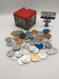 Tin full of approx. 70 vintage Mardi Gras & Saint Patricks day collectible event tokens.