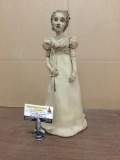 Clay statue of woman signed by artist Joy. Measures approx 16x10x8 inches.