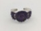 Sterling silver bracelet with purple stones.