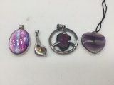 Collection of 4 sterling silver pendants some with stones.