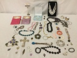 Over 35 pieces of estate jewelry, incl. bracelets, necklaces, two bags, pendents & more.