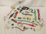Approx. 40 pieces of estate jewelry, incl. necklaces, rings, a Grandpa belt buckle, & more.