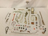 Over 60 pieces of estate jewelry, incl. necklaces, earrings, pins, and loose estate jewelry bits.