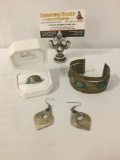 Three pieces of jewelry, incl. a Henry Ritchies ring, a brass cuff w/stone scarab inlaid, & a pair