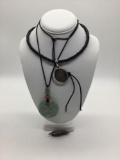 Jade pendant, sterling silver and abalone pendant and sterling brooch.