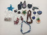 Collection of glass bracelets, earrings and pendants.