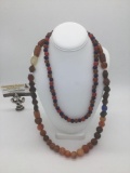 Two colorful necklaces, including a necklace of 46 stones, and a necklace consisting of 67 colorful