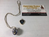 Lot of 2; sterling silver necklace with enamel egg and 14K gold heart shaped enamel pendant approx