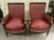 2 French red cushion parlor arm chairs with gold tone claw foot pieces and ladies faces