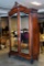 antique 1870s Italian armoire w/ mirror doors, carved crown & floral design Approx 54x24x99 in.