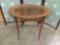 Antique French oval end table. Measures approx 26x22x18 inches.