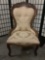Vintage wood carved floral pattern upholstered parlor chair, approx 25x22x38 inches.