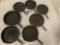 Lot of 7 antique cast iron frying pans.