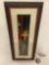 Framed acrylic/enamel (?) artwork of a woman, approx 10 x 25.5 inches. Marked; La Tavolozza