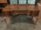 Antique English walnut vanity/ desk without mirror, approx 21x42x32 inches. Trim piece needs repair