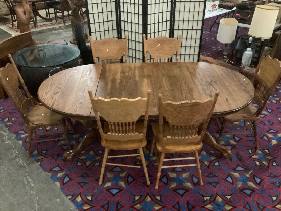 Antique style oak pedestal base claw foot dining table with 2 cleaves & 6 matching carved chairs