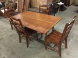 Vintage wood drop-leaf dining table with 4 wooden chairs, approx 38x61x30 inches.