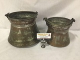 Pair of antique copper and brass buckets. Largest measures approx 10x10x8 inches.