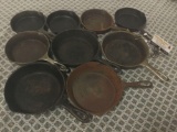 Collection of 9 antique and vintage Wagner stylized script cast iron pans.