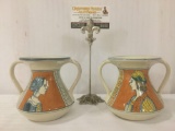 Pair of Italian Deruta hand painted two handled cups, depicting a man & woman, approx. 6x5x5 inches