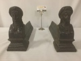 Pair of antique metal andirons w/busts of the Iranian princess Saltane (?), approx. 17x4x9 inches.