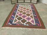 1920s Persian wool rug w/fringe , dynamic colors & striking patterns, approx. 84x45 inches.