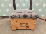 Hand made wooden ottoman with Native American inspired patterns. Measures approx 18x16x12 inches.