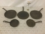 Five modern Wagner 1891 U.S. made cast iron pans, some wear, see pics, approx. 16x12x5 inches.