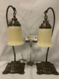 Pair of vintage/antique European corded metal table lamps w/ornate bases & glass shades. Sold as is.
