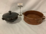 An antique stoneware vessel & a vintage dark ceramic lidded bowl, both with handles.
