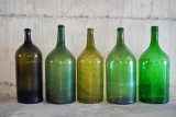 Lot of 5 large vintage green glass bottles, unmarked, approx 5 gallons / 25x9 inches.