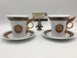 Pair of French Limoges fine China tea cups w/facial designs & saucers, approx. 6x6x4 inches.