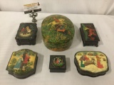 Six enamel trinket box?s w/images of horses, people, & rural settings. Largest is approx. 8x6x3 in.